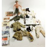 An action man figure and various clothes and accesories