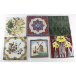 A group of 22 various Victorian and later floral decorated tiles, plus a Delft tile