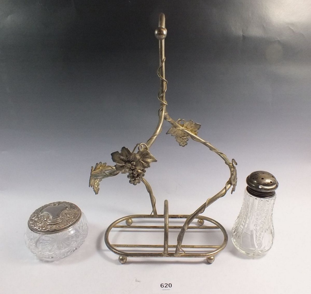 A silver plated vine form bottle holder, a cut glass and silver topped sugar caster and a cut