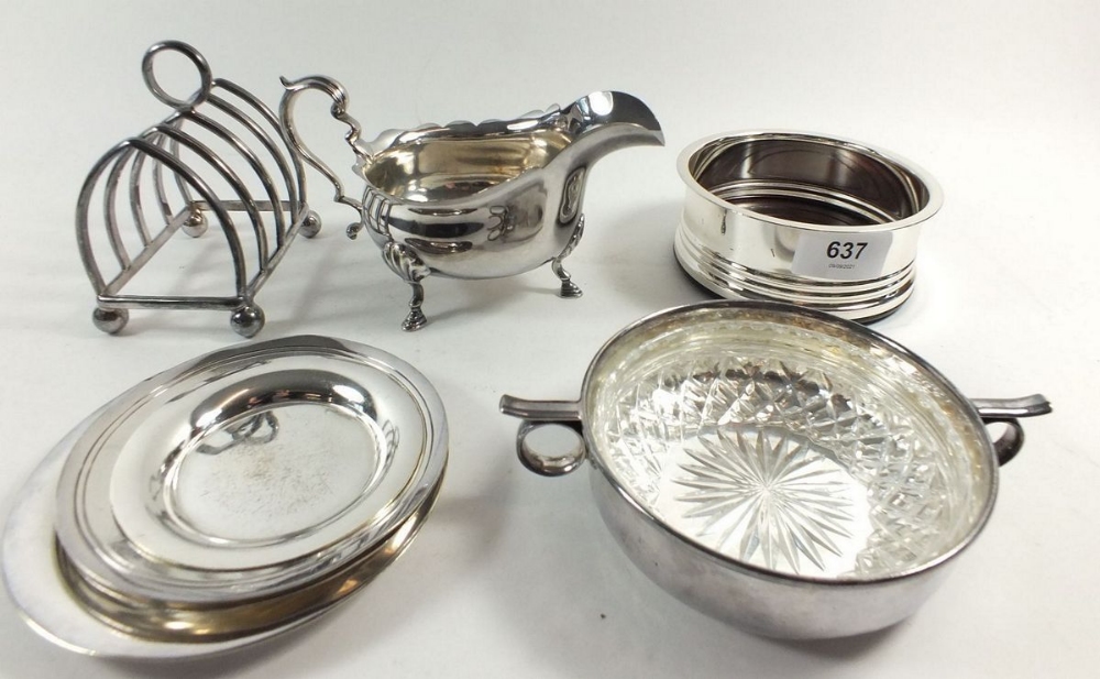 A box of silver plated items including toast rack, bottle coaster etc.