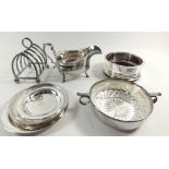 A box of silver plated items including toast rack, bottle coaster etc.