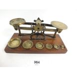 A set of brass and mahogany postage scales and weights stamped Browne & Nolan, Dublin