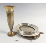 A silver vase 15.5cm and an oval silver photograph frame, 17 x 14cm