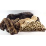 An ocelot fur muff and four various fur stoles