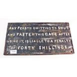 A cast iron antique railway notice 'Any person omitting to shut and fasten the gate after using is
