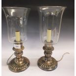 A pair of Sheffield plated candle or storm lamps with glass shades, now converted to electricity