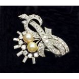 A vintage French 18 carat white gold diamond scroll brooch set two pearls, with hinged pin fastener,
