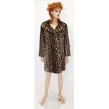 A ladies ocelot fur coat