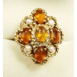 A 9 carat gold cluster ring set orange stone and pearls, size N