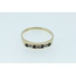 A 9 carat gold ring line set sapphires and chip diamonds, size Q