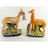A pair of 19thC Staffordshire greyhound or whippet figures, one with hare in mouth, 26cm