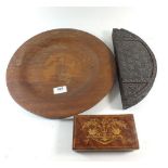 An Indian semi circular carved wood box and a bentwood tray