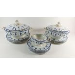 An Edwardian blue and white dinner service comprising: two lidded tureens, eleven dinner plates, six