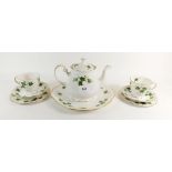 A Colclough Ivy pattern part tea set comprising: six tea cups and saucers, six tea plates, cake