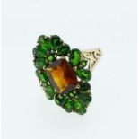 A 9 carat gold ring set green and orange topaz stones, 4.5g, size N