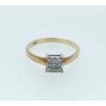 A 9 carat gold ring set square panel of nine princess cut diamonds, size P