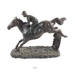 A bronze finish group of a jockey and horse, 31cm wide