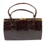 A vintage crocodile skin handbag