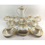 An Elizabethan 'Swiss Cottage' coffee set comprising: coffee pot, ten cups and saucers, five tea