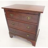 A small Georgian mahogany chest of three drawers, 61cm wide