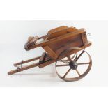 A wooden toy cart, 32cm tall