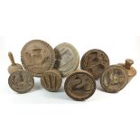 Nine various antique wooden butter stamps with carved motifs such as thistle cow and swan