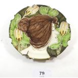 A Faience dish painted Art Nouveau ladies head, signed to reverse, 14.5cm diameter