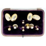 A pair of 15 carat gold cufflinks and a stud, 6.5g plus four 18 carat gold studs and a pair of 18