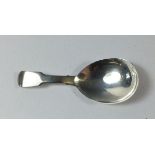 A silver fiddle pattern caddy spoon, London 1824 by William Schofield, 10.5g