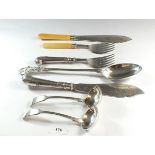 A large silver plated basting spoon and various other silver plated items including fish servers,