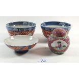 A pair of Chinese bowls with red and blue decorations (one a/f) and another shallow Chinese bowl and