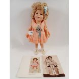 A Shirley Temple doll in pink taffeta dress with original badge and silk label