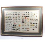 A framed display of fishing flys, 74 x 56cm