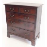 A George III mahogany chest of two short and three long drawers all raised on tall bracket supports,