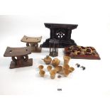 A group of Chinese treen items including two stands, child's tea set, carved panel etc.