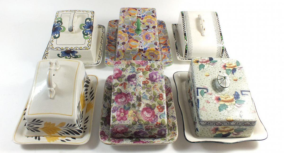 Six Edwardian and later cheese dishes with covers