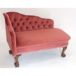 A pink upholstered child's or pets chaise longue