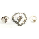 A silver and mother of pearl cameo ring, a rolled gold ring and a Siam silver brooch
