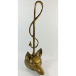 A brass fox head door stop