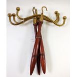 Three brass and turned wood wig and gown hangers