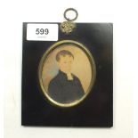 A 19th century watercolour miniature portrait on card of boy, signed W H Stanners