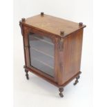 A Victorian walnut small cabinet with glazed door and marquetry decoration