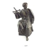 An antique bronze figure of St Paul, 25cm tall