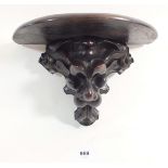 A Victorian carved mahogany bracket in form of a lions head, 17cm tall