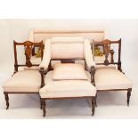 An Edwardian salon suite with marquetry decoration comprising: settee, two side chairs and armchair