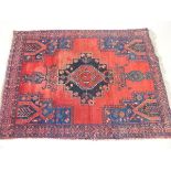 A blue and red Turkoman rug with lozenge design 186 x 132cm