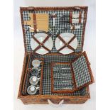 A wicker cased picnic set