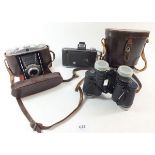 A pair of Pentax binoculars, and two Agfa folding cameras
