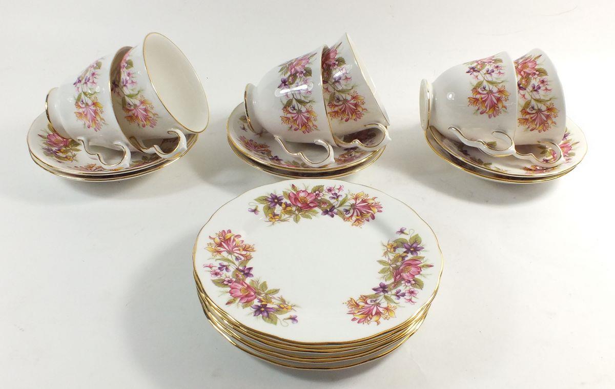 A Coclough 'Wayside' floral tea service comprising: six cups and saucers and six tea plates