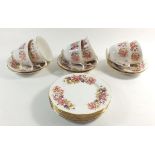 A Coclough 'Wayside' floral tea service comprising: six cups and saucers and six tea plates